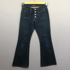 Vintage Japanese Bush Pants Button Fly Blue Wash Jeans Denim - GF30011.  Manual Measurement (laying in flat area):  1) Waist: 28 inch.  2) Rise: 9 inch.  3) Hips: 18 inch.  4) Tight: 10.5 inch.  5) Outseam: 37.5 inch.  6) Inseam: 29 inch.  7) Leg opening: 10 inch.  Fabric Material: 100% Denim Cotton.  Condition: In good vintage condition overall.  Please check all the measurement to insyre a proper fit.  Remember to allow yourself some extra room for movement.  You can compare these information 90s Style High Waist Denim Blue Flare Jeans, 90s High Waist Denim Blue Flare Jeans, 90s Style Dark Wash Mid-rise Pants, 90s Style Mid-rise Dark Wash Pants, 90s Dark Wash Mid-rise Pants, Retro Mid-rise Flare Jeans For Streetwear, 90s Style Full-length Denim Flare Jeans, Fitted Straight Leg Jeans With Buttons, 90s Style Wide Leg Jeans