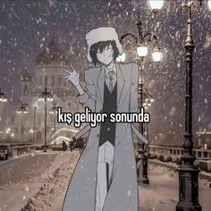 a person standing in the snow wearing a coat and hat with words on it that reads,