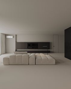 a large white couch sitting in the middle of a living room