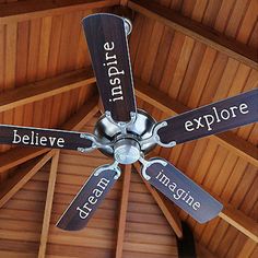 a ceiling fan with the words inside and below it that reads believe, explore, team imagine