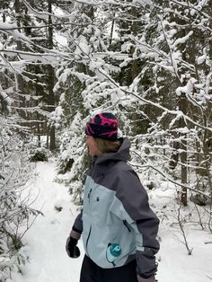 a person riding skis down a snow covered slope