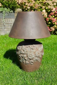 a lamp that is sitting in the grass