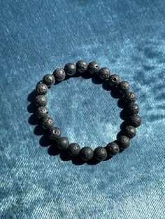 **Lava Stone Beaded Bracelet - 8mm Lava Beads** Discover the grounding and healing properties of our handmade Lava Stone Beaded Bracelet. Crafted with care using 8mm lava beads, this bracelet not only serves as a stylish accessory but also offers numerous benefits for your well-being. **Grounding Energy Lava stone is known for its grounding qualities, helping to stabilize emotions and promote a sense of calm and balance. **Emotional Healing This stone can assist in dissipating anger, providing s Hand-strung Lava Stone Bracelets, Handmade Spiritual Obsidian Bracelets, Healing Bracelet With Gemstone Beads And Lava Stone, Healing Lava Stone Beaded Bracelets, Healing Lava Stone Bracelets With Gemstone Beads, Spiritual Beaded Obsidian Bracelets, Round Beads Bracelet With Natural Lava Stone, Spiritual Lava Stone Bracelets With 8mm Beads, Hand-strung Lava Stone Bracelets With Round Beads