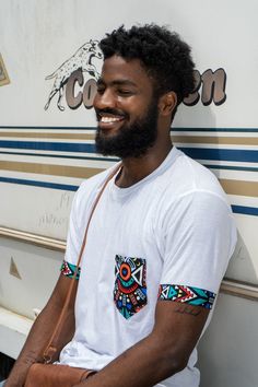 Our African Tribal Print Unisex T-shirt is great for an everyday look.⠀Whether you are looking to go casual, elegant or just basic.⠀The fabric of this shirt has a soft feel, with colourful and bold tribal prints details as the pocket and the arms.Makes it one to fall in love with - over and over again.⠀It is lightweight and can be styled with jeans to create a relaxed, yet trendy outfit.⠀This T-shirt is a very great gift idea⠀This T-shirt design comes in all sizes⠀100% Soft Cotton (fibre content Men Gift Ideas, Trendy Outfit, Women T Shirts, Everyday Look, Cotton Fiber, Falling In Love, Fall In Love, Trendy Outfits, Unisex T Shirt