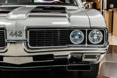 the front end of an old muscle car