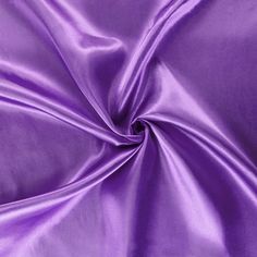 a close up view of a purple satin fabric