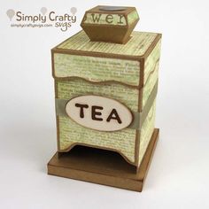 a small wooden box with a tea sign on top