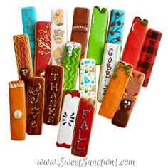 an assortment of colorful decorated candy sticks