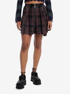 Combine edgy vibes with scholarly sophistication with this pleated skirt! Perfect for the dark academia look  this black and purple skirt features removable suspender straps  plus a zipper on the front with O-ring detailing.Please note: Style is fitted with no stretch; size up for a looser fit.65% polyester; 35% rayonWash cold; dry flatNon-stretch materialLength: 32''ImportedListed in junior sizesModel is 5'9''Model wears size Small Gothic Pleated Mini Skirt For Fall, Punk Pleated Skirt For School, Punk Style Pleated Skirt For School, Edgy Pleated Skirt For School, Punk Pleated Mini Skirt For Fall, Edgy Pleated Bottoms For Fall, Hot Topic Skirts, Academia Look, Dark Academia Look