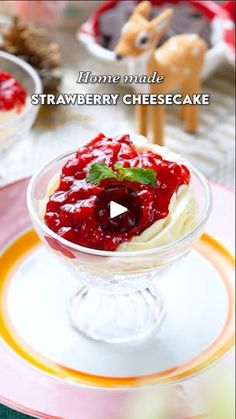 a video showing how to make strawberry cheesecake in an ice cream sundae dish