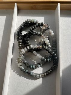 Gemstone bracelets can be worn by everyone. These gemstone bracelets fit a 7.5-8 inch wrist. Message for more sizes. Neutral grey & black ombré of 8mm labradorite, cloudy quartz, amazonite, pyrite, lava, hematite, onyx and agate. Bold blue ombré of aventurine, sodalite, jade & blue goldstone. Perfect for gift giving. Comes ready for gift giving in black gift box and ribbon. Rondelle Beaded Bracelets With 8mm Beads As Gift, Rondelle 8mm Bead Bracelets As Gifts, Spiritual Rondelle Crystal Bracelet Gift, Rondelle Crystal Bracelet With 8mm Beads As Gift, Rondelle Crystal Bracelet With 8mm Beads, Gemstone Beads Rondelle Stretch Bracelet As Gift, Gemstone Beads Rondelle Bracelet For Gift, Gemstone Beads Stretch Bracelet Gift, Gemstone Beads Rondelle Bracelet As Gift