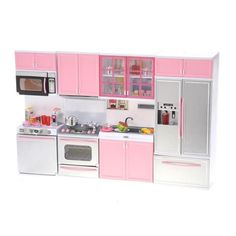 a toy kitchen with pink cabinets and white appliances