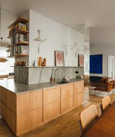 the kitchen is clean and ready to be used as a dining room or living room