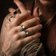 a man with two rings on his fingers