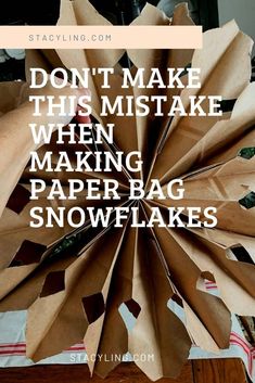 paper bag snowflakes with the words don't make this mistke when making paper bag snowflakes