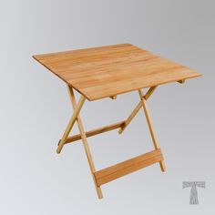 a small wooden table with two folding legs