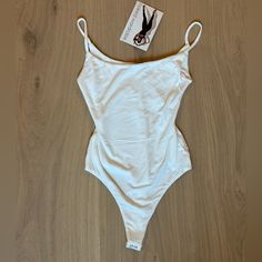 Brand New With Tags. Small White Bodysuit Spaghetti Straps. Non-Smoking Household. Summer Loungewear Bodysuit With Built-in Bra, Summer Fitted Camisole For Loungewear, Summer Loungewear Bodysuit With Adjustable Straps, Summer Scoop Neck Loungewear Bodysuit, Summer Scoop Neck Bodysuit For Loungewear, Scoop Neck Bodysuit For Summer Loungewear, Summer Loungewear Camisole With Lined Body, Summer Lined Camisole For Loungewear, Summer Loungewear Lined Camisole