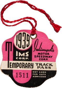 a pink and black sign hanging from a red string on a white background with the words temporary track pass