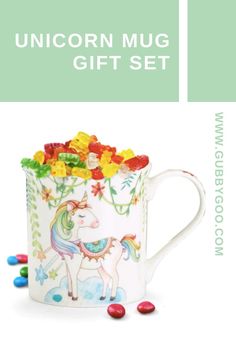 a unicorn mug with candy in it and the words unicorn mug gift set above it