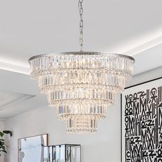 a chandelier hanging from the ceiling in a living room