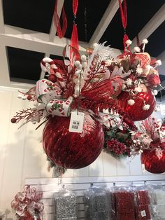 red and white ornaments hanging from the ceiling