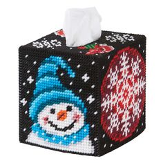 a christmas themed tissue box with a snowman on it