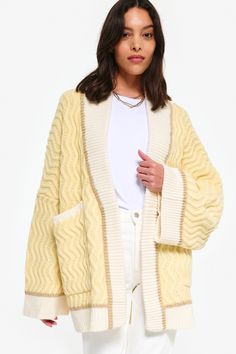 Crafted with 100% luxurious merino wool, the Oversized Cardi from King & Tuckfield is a must-have for your wardrobe. Designed by creative director Stacey Wood, this cardi embodies the brand's commitment to slow fashion and ethical production. With its oversized fit, it's the perfect statement piece for any outfit. Oversized Beige Wool Cardigan, Oversized Cream Cashmere Outerwear, Oversized Merino Wool Sweater For Spring, Oversized Textured Knit Cream Outerwear, Oversized Yellow Winter Cardigan, Oversized Yellow Cardigan For Winter, Cozy Oversized Yellow Outerwear, Cream Cardigan Outfit, Yellow Cardigan