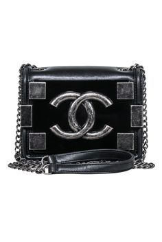 Mini and chic, this Chanel “Boy Brick” crossbody gem designed by Karl Lagerfeld is composed of luxurious black lambskin and marked by the unmistakable 'CC' logo surrounded by aged silver-tone squares. Team it with a leather jacket and distressed jeans for a rebellious vibe, or contrast it with a sleek blazer and killer heels for a high-fashion twist. Shell 100% Lambskin leather Grosgrain lining Interlocking “CC” logo Aged silver-tone hardware Chain link shoulder strap One interior slide-in pocke