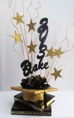 a cake topper with stars on it and the word bake spelled in black