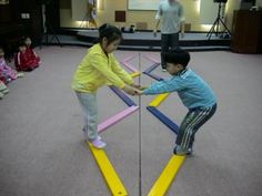 two children are playing with an interactive game