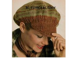 a woman wearing a knitted hat with the words befunk factory on it