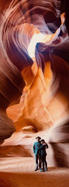 two people standing in the middle of a desert