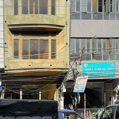 two trucks are parked in front of an apartment building