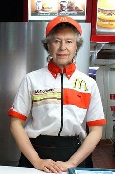 an older woman standing behind a counter in a fast food restaurant wearing a mcdonald's uniform