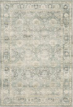 an area rug with light blue and beige colors