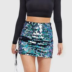 Unleash Your Inner Sparkle Step into a world of glamour and shine with our High Waist Glitter Sequin Mini Skirt, a perfect blend of style and comfort for the modern woman. Designed to turn heads, this skirt is your go-to piece for any season, ensuring you stand out in every crowd. Product Features Our skirt boasts a stunning sequined decoration on a solid, woven polyester fabric that catches the light beautifully. The straight silhouette paired with a flattering empire waistline accentuates your Trendy Stretch Skirt For Party Season, Trendy Mini Skirt For Party Season, Metallic Stretch Skirt, Trendy Stretch Skirt For Party, Glamorous Stretch Skirt With Sequins, Glamorous Stretch Mini Skirt, Glamorous Stretch Skirt, Stretch Skirt For Night Out And Holiday, Stretch Skirt For Holiday Night Out