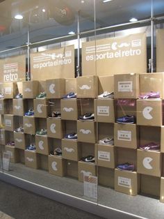 several cardboard boxes stacked on top of each other in front of a glass window with the words esportale retro