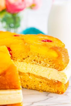 a close up of a cake on a plate with a piece cut out and ready to be eaten