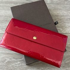 Purchased From Louis Vuitton Store, Hawaii Cuir Verni Red Color With A Fabric Pouch, Box, 3 Small Cards, 1 Little Booklet Inside The Wallet Has Code: Th1027 Has Tiny Spot In The Back (The Black Tiny Dot That In The Picture) Also One Edge/ Side (Left Top Corner) Has Some Marks (The Very Last Picture) Otherwise In Good Condition. Comes With 1 Paper Louis Vuitton Bag Louis Vuitton Store, Fabric Pouch, Small Cards, Vuitton Bag, Louis Vuitton Bag, Red Color, The Black, Hawaii, Bag Lady