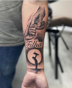 a person's arm with a tattoo on it that reads fillia and the image of a woman doing yoga