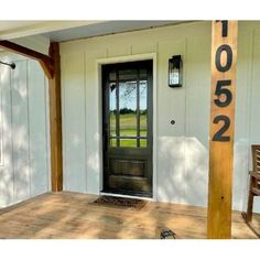 the front door of a house with a number on it