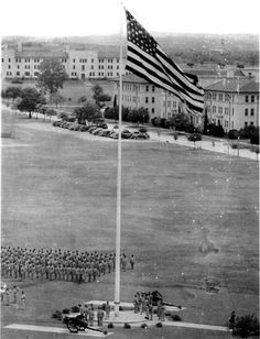 an old black and white photo shows the american flag at half mast