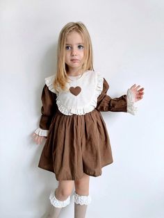 Full mold. There is a lining inside. Fabric type : Linen. Collar : Baby collar. Unfortunately, the brown model dress is out of stock. Cream color has all ages. 🙏  Product size measurements ; 1-2 Age; Width : 27*2 : 54 cm Length : 43 cm Sleeve Length : 30 cm 2-3 Years ; Width : 29*2 : 58 cm Height : 46 cm Arm Length : 31 cm 3-4 Years ; Width : 31*2: 62 cm Height : 49 cm Arm Length : 33 cm 4-5 Years ; Width : 33*2: 66 cm Height : 51 cm Arm Length : 34 cm 5-6 years ; Width : 33*2: 66 cm Height : 5 Toddler Pinafore Dress, Vintage Cottagecore Dress Kids, Vintage Linen Dress, Toddler Collared Dress, Kids Linen, Vintage Dress With Ruffle Hem And Doll Collar, Peter Pan Collar Dress Toddler, Kids Winter Fashion, Bow Sash