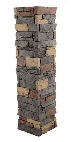 a tall stack of stone blocks with different colors and sizes on each side, against a white background