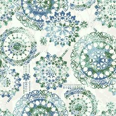 an abstract blue and green pattern on white paper