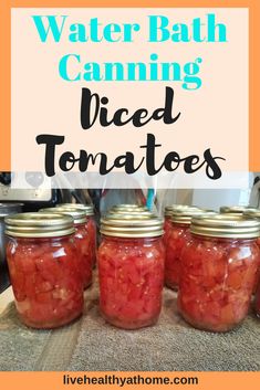 four jars filled with diced tomatoes sitting on top of a counter next to the words water