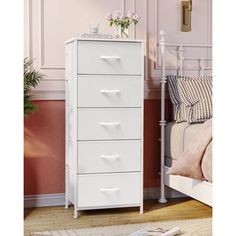 a white chest of drawers in a bedroom