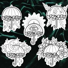 four stickers depicting umbrellas and flowers on a green velvet background in black and white