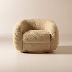 the chair is made out of wool and has a rounded seat that sits in front of it