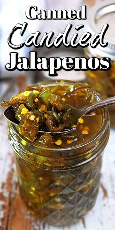 a glass jar filled with pickled jalapenos on top of a wooden table